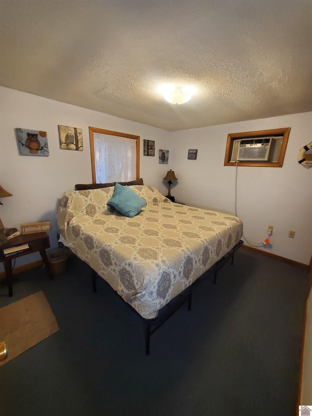 carpeted bedroom featuring a textured ceiling and a wall mounted AC