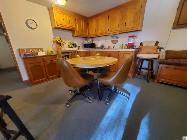 view of carpeted dining area