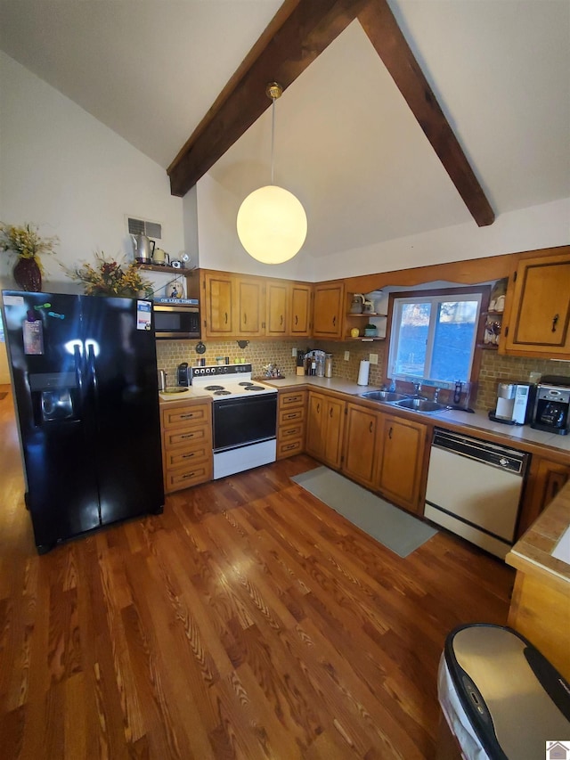 kitchen featuring dark hardwood / wood-style floors, hanging light fixtures, stainless steel appliances, decorative backsplash, and sink