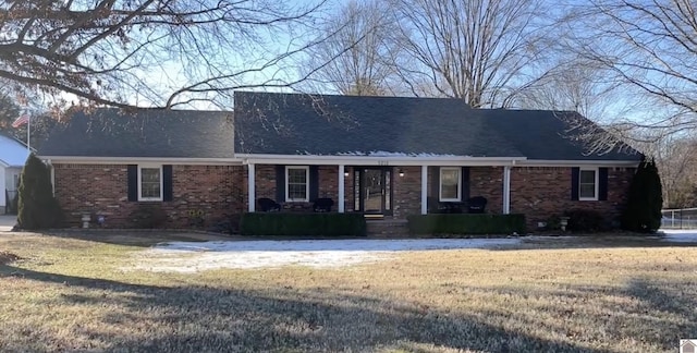 ranch-style house featuring a front lawn