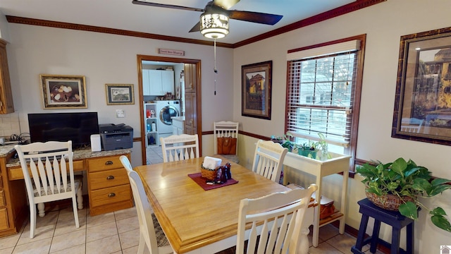 dining room featuring washer / dryer, ceiling fan, light tile patterned floors, and ornamental molding