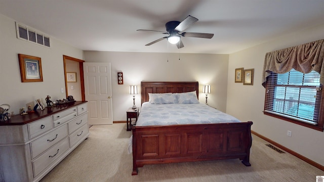 bedroom featuring ceiling fan and light colored carpet