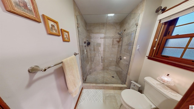 bathroom featuring an enclosed shower, toilet, and tile patterned flooring