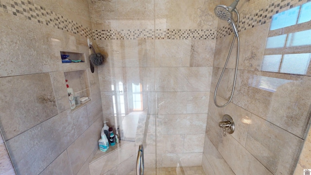 bathroom with tiled shower