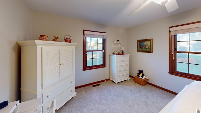 carpeted bedroom with ceiling fan