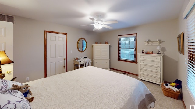 carpeted bedroom with ceiling fan