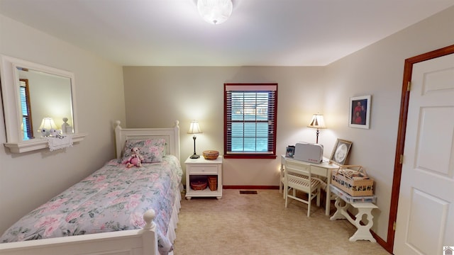 bedroom with light colored carpet