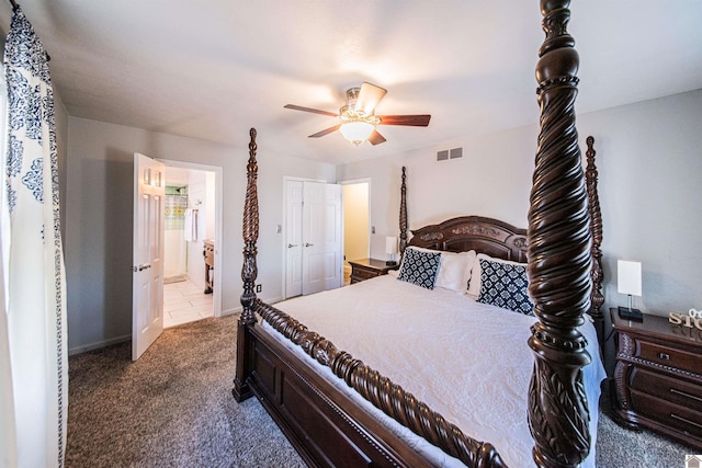 bedroom featuring ensuite bathroom, ceiling fan, and carpet