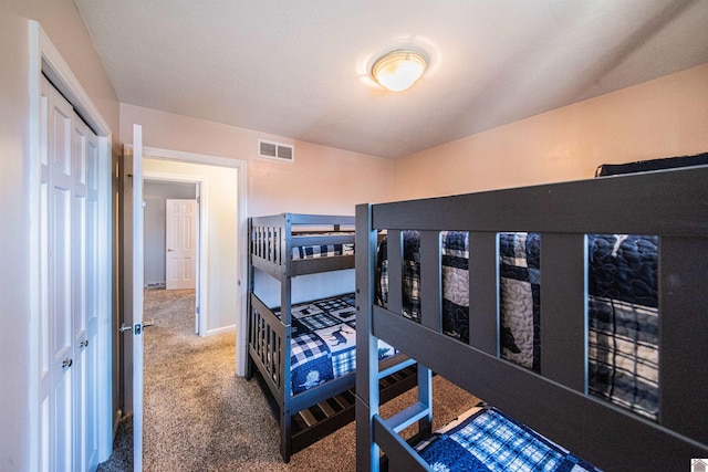 carpeted bedroom with a closet