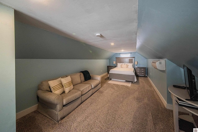 carpeted bedroom featuring lofted ceiling