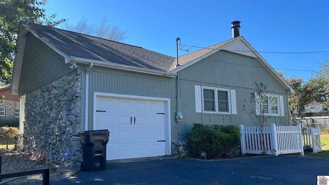 view of side of property featuring a garage