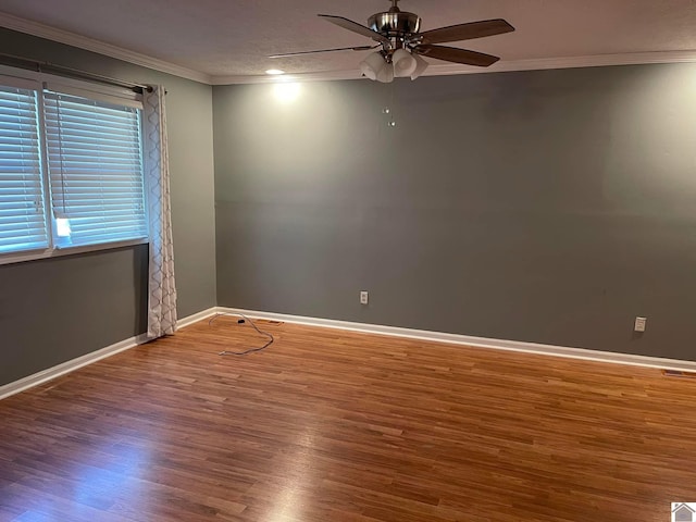 empty room with ceiling fan, a textured ceiling, ornamental molding, and hardwood / wood-style flooring