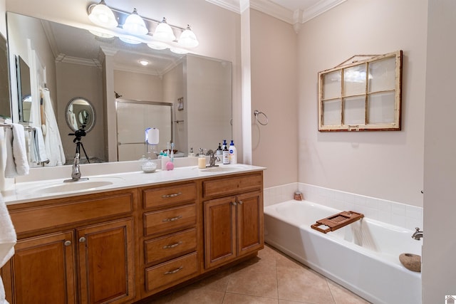 bathroom featuring tile patterned floors, vanity, crown molding, and separate shower and tub