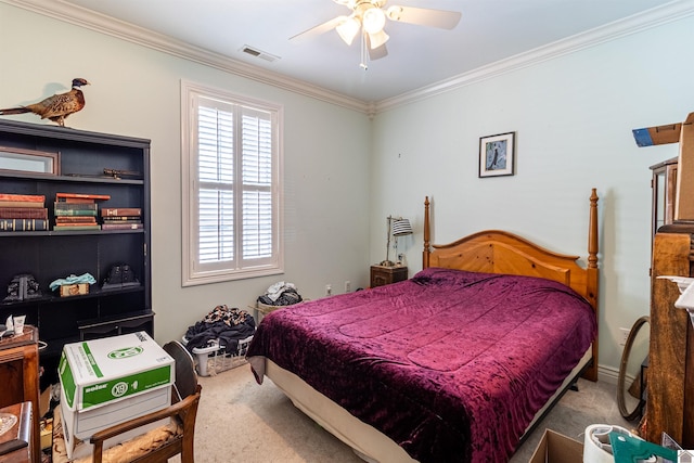 carpeted bedroom with ceiling fan and ornamental molding