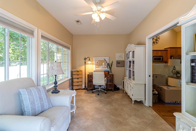 office featuring ceiling fan and light tile patterned flooring