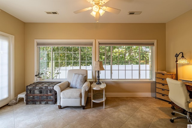 interior space with ceiling fan