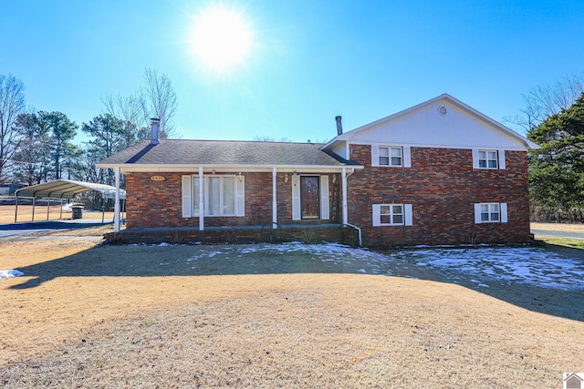 tri-level home featuring a carport