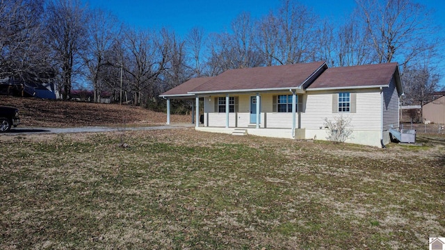 view of front facade featuring a front lawn and a porch