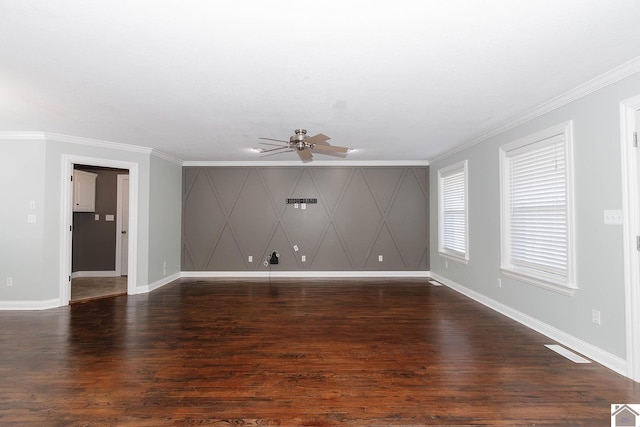 spare room featuring ceiling fan, dark hardwood / wood-style floors, and crown molding