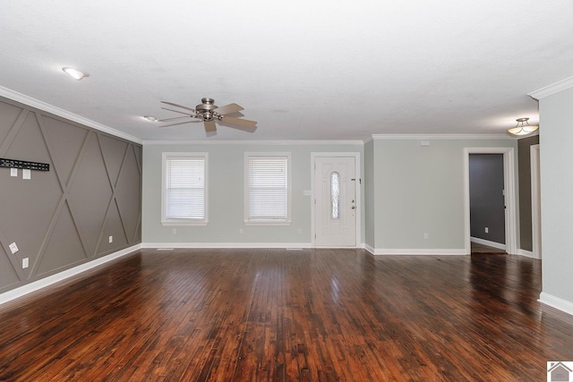 unfurnished living room featuring dark wood-type flooring, ceiling fan, and ornamental molding