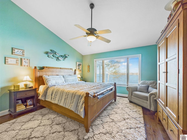 bedroom featuring dark wood-type flooring, ceiling fan, and lofted ceiling