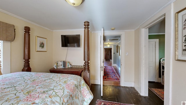 bedroom with dark wood-type flooring and ornamental molding