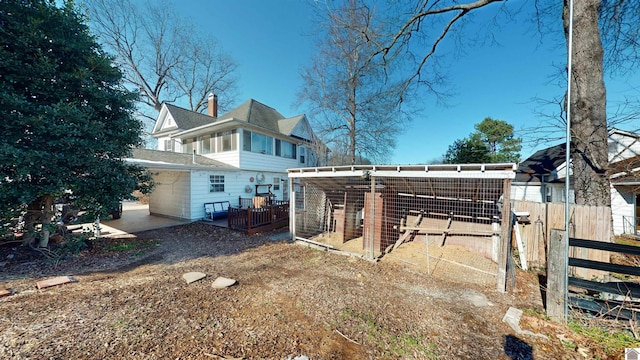 back of property with an outdoor structure