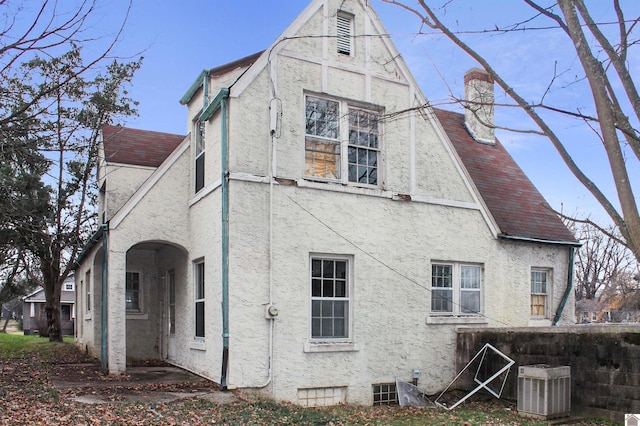 rear view of house with central air condition unit