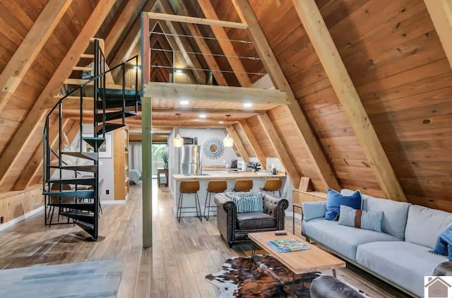 unfurnished living room with wooden ceiling, hardwood / wood-style floors, wood walls, and vaulted ceiling with beams