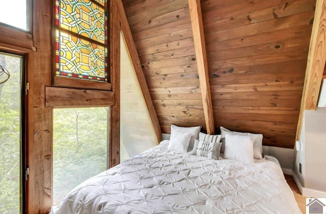 unfurnished bedroom featuring vaulted ceiling with beams, wood ceiling, and hardwood / wood-style floors