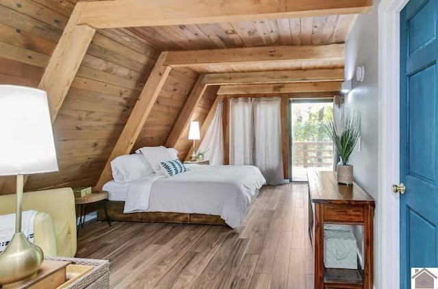 bedroom featuring hardwood / wood-style flooring, beam ceiling, access to outside, and wood ceiling