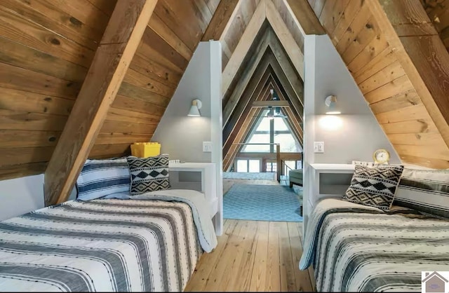 bedroom featuring wooden ceiling, wood-type flooring, and lofted ceiling