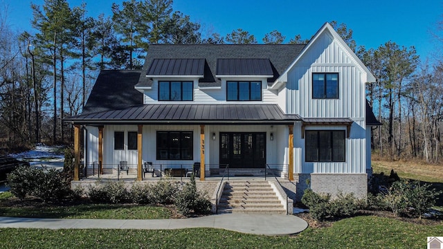 modern farmhouse featuring covered porch