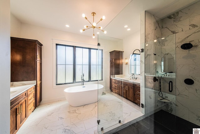 bathroom with vanity, separate shower and tub, and an inviting chandelier