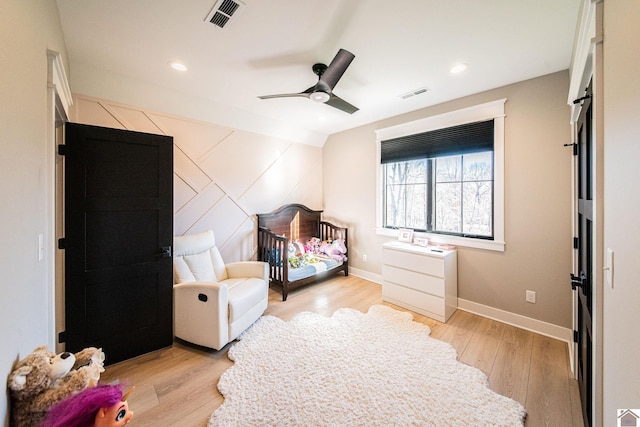 bedroom featuring ceiling fan, lofted ceiling, and light hardwood / wood-style flooring