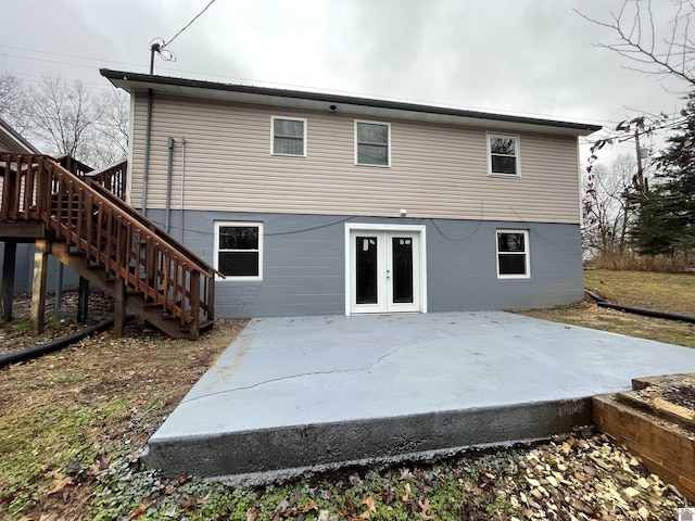 back of property with a patio area and french doors