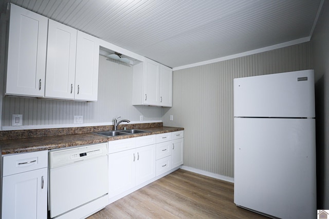 kitchen with light hardwood / wood-style flooring, white cabinets, and white appliances