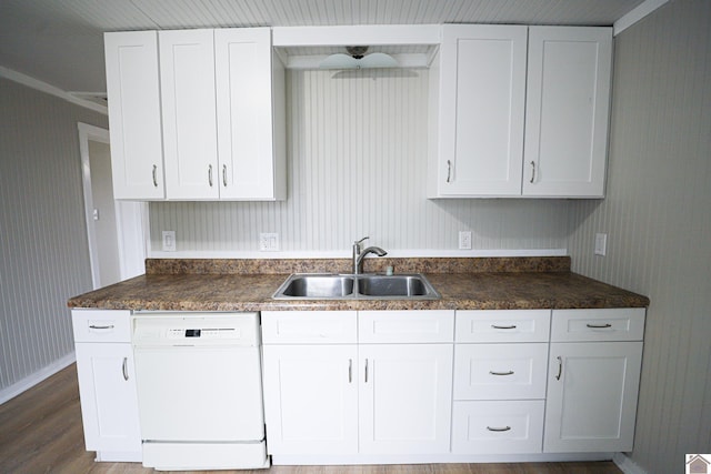 kitchen featuring hardwood / wood-style flooring, sink, white cabinetry, and dishwasher