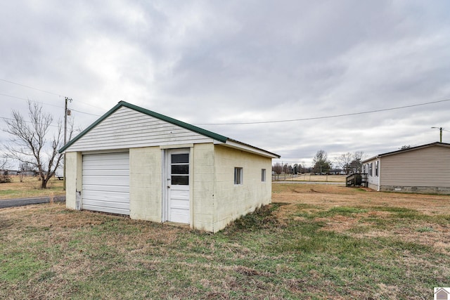 garage with a lawn