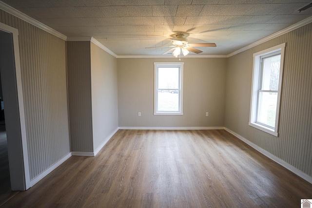 spare room featuring ceiling fan, ornamental molding, and hardwood / wood-style floors