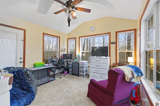 office with ceiling fan, lofted ceiling, and light colored carpet