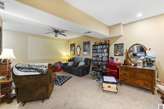 living room with ceiling fan and light colored carpet