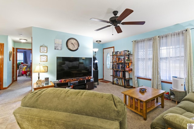 tiled living room featuring ceiling fan