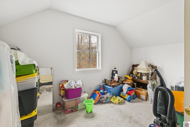 playroom with vaulted ceiling and carpet flooring