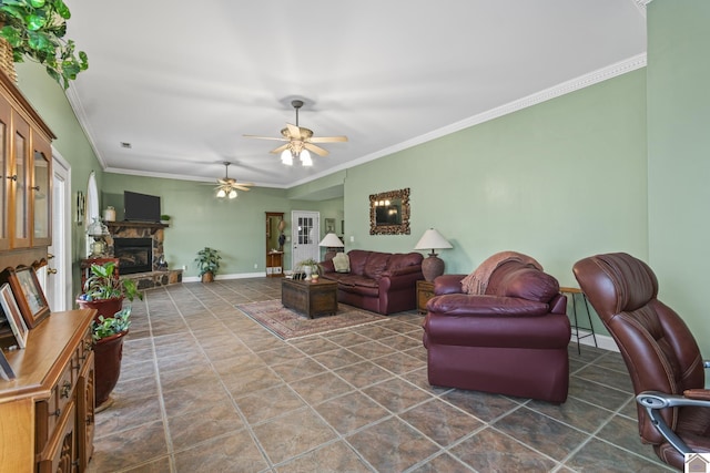 living room with ceiling fan, crown molding, and a stone fireplace