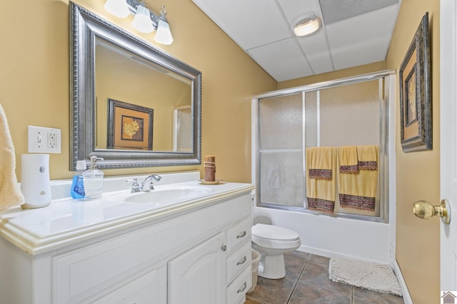 full bathroom with toilet, vanity, tile patterned flooring, and shower / bath combination with glass door