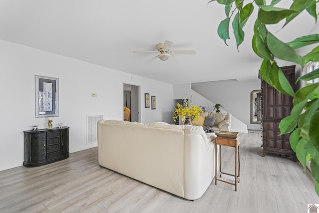 living room with ceiling fan and light hardwood / wood-style floors