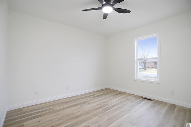 unfurnished room with light wood-type flooring and ceiling fan