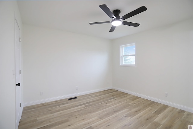 spare room featuring ceiling fan and light hardwood / wood-style flooring