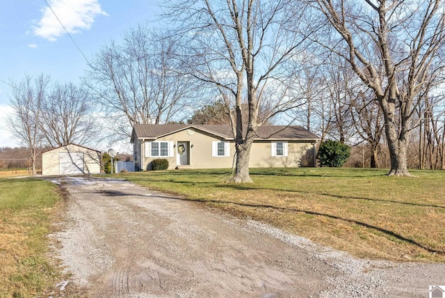 ranch-style house featuring a front yard and a storage shed